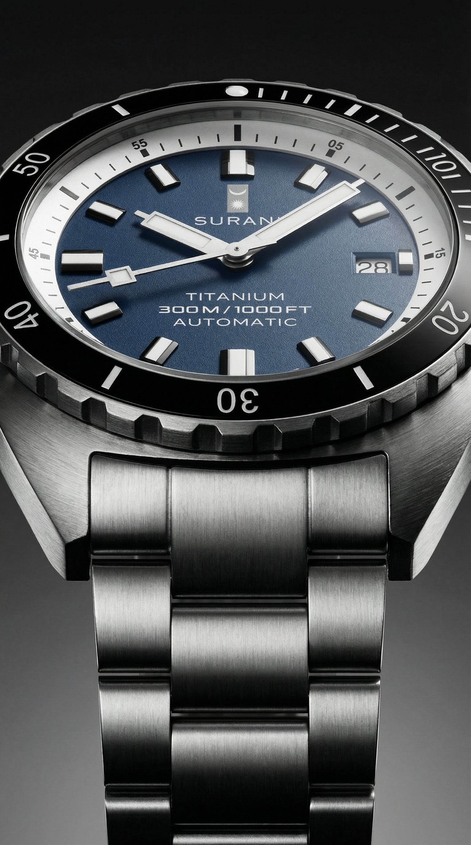 Suran watch with blue dial and metallic band on a dark background