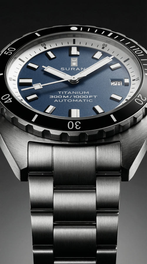 Suran watch with blue dial and metallic band on a dark background