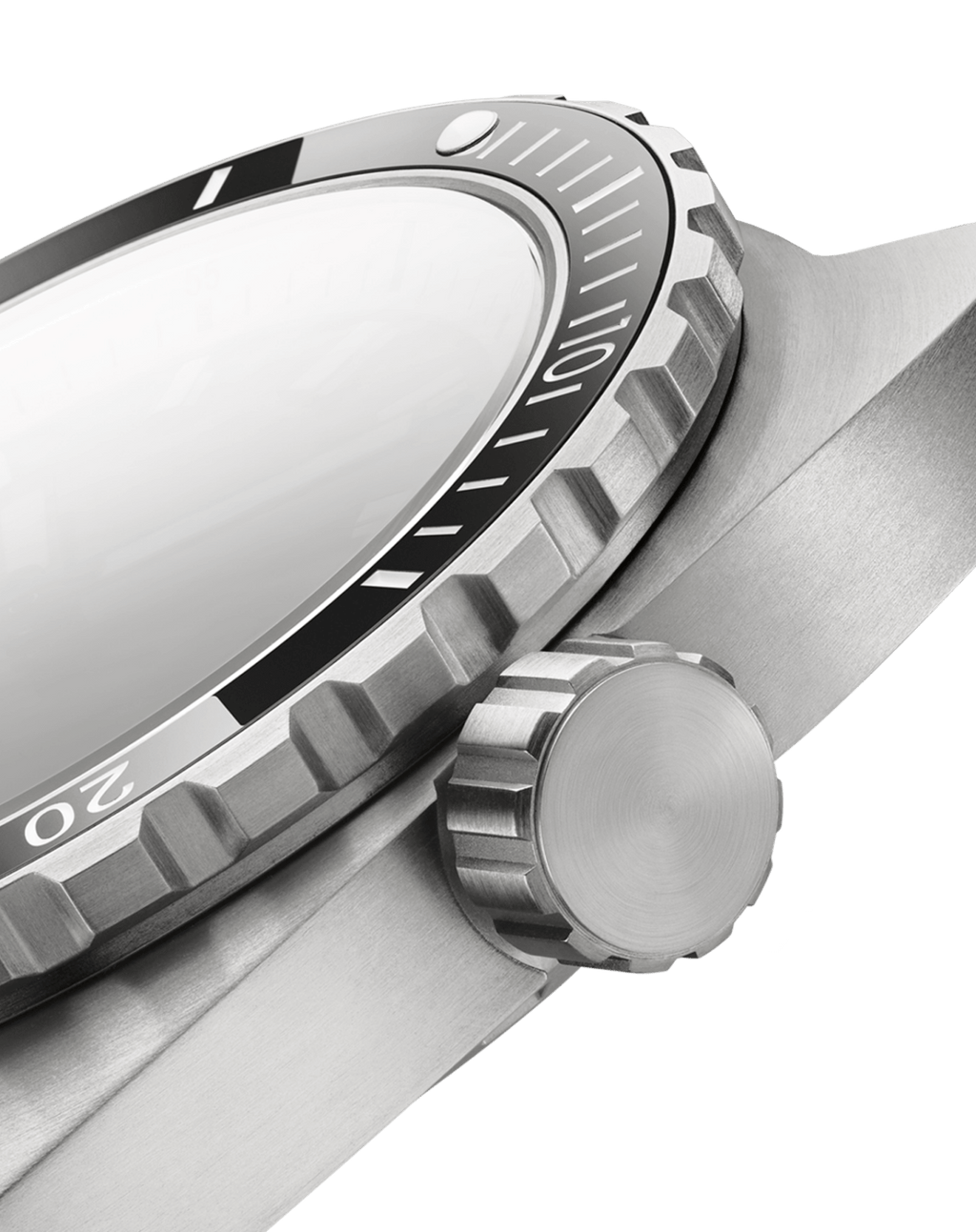 Close-up of a silver watch with a black bezel on a black background