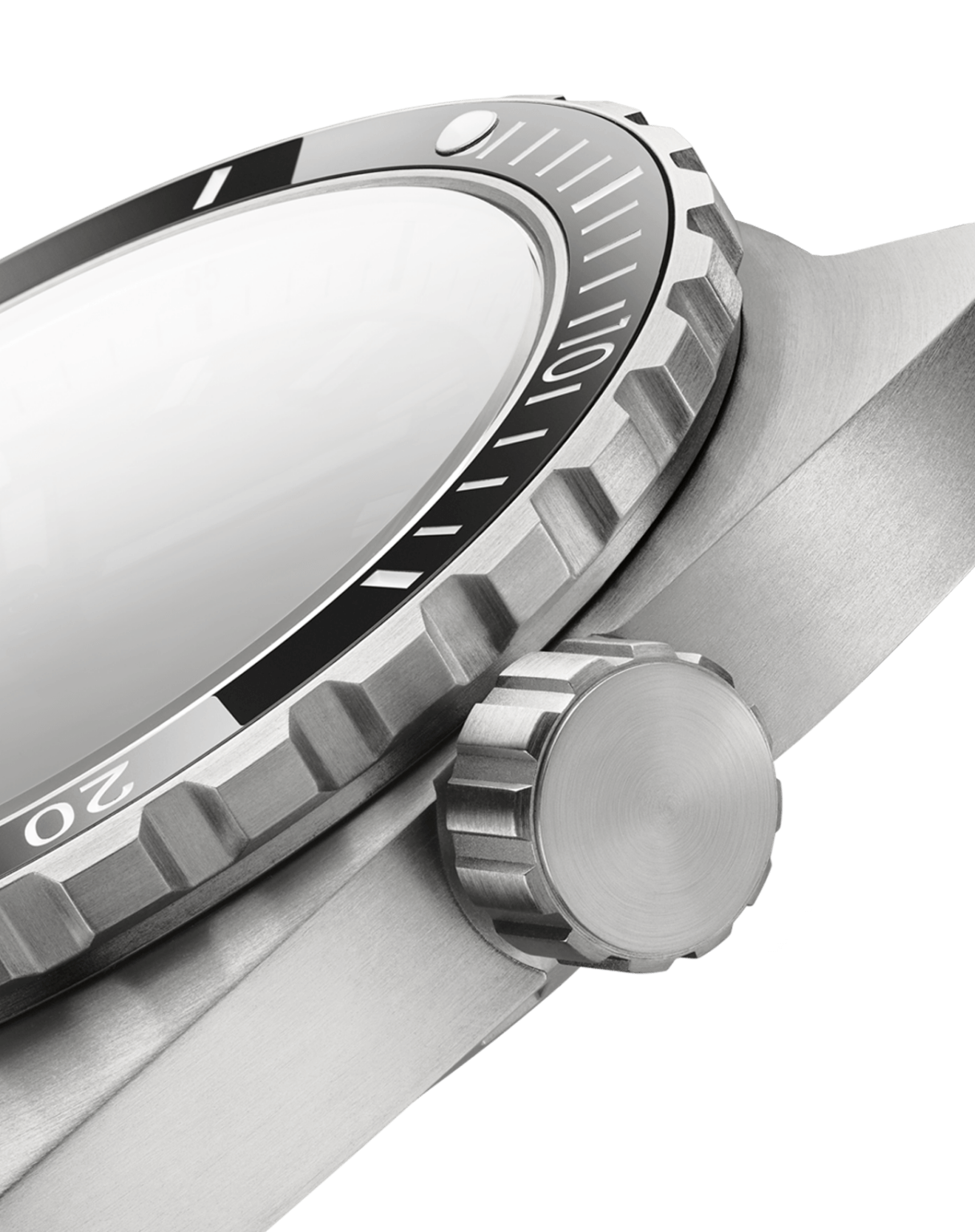 Close-up of a silver watch with a black bezel on a black background
